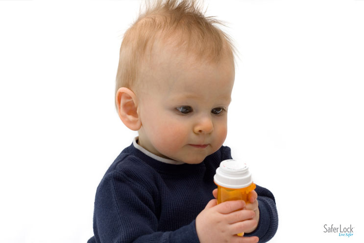 A baby holds a prescription bottle. Learn the five everyday items laying around your home that need to be securely locked up.
