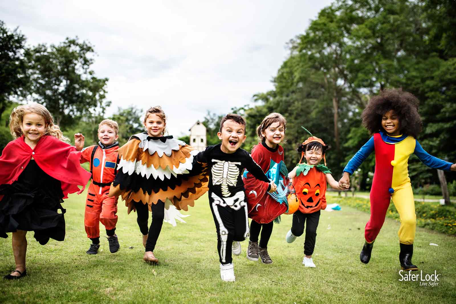 Group of kids trick or treating on Halloween. Get safety tips for a safe and fun holiday at SaferLockrx.com