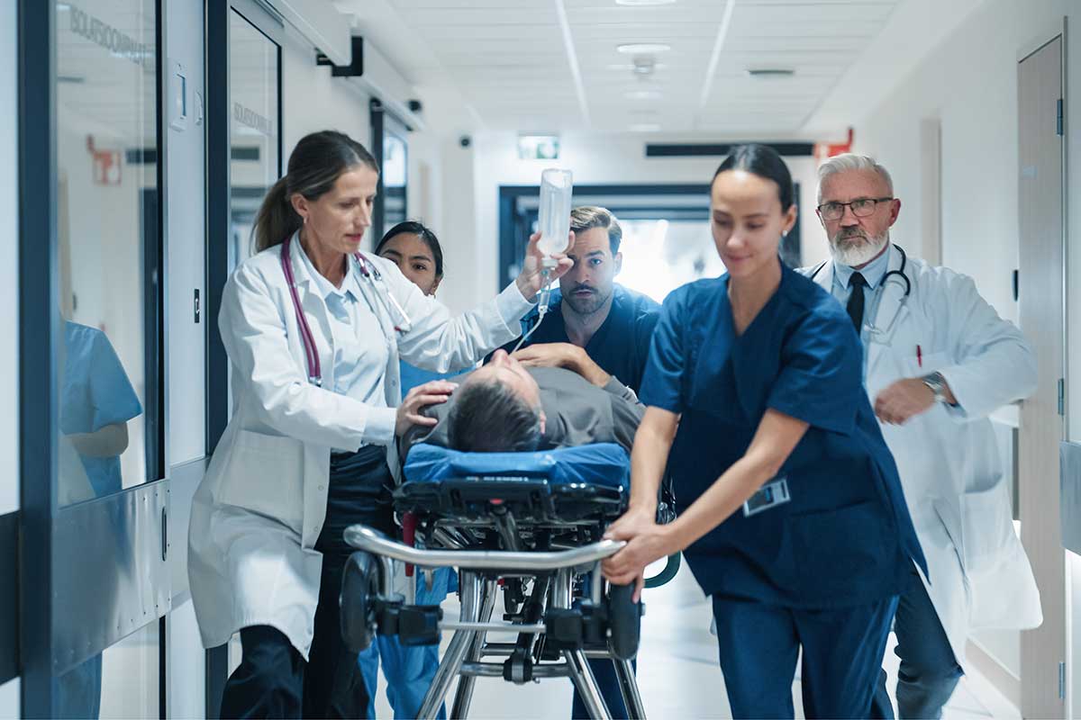Emergency medical team pushing a patient down the hallway for treatment for medetomidine withdrawal syndrome.