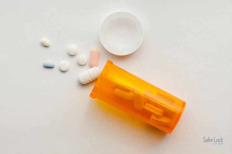 Image of an open prescription bottle with spilled pills.
