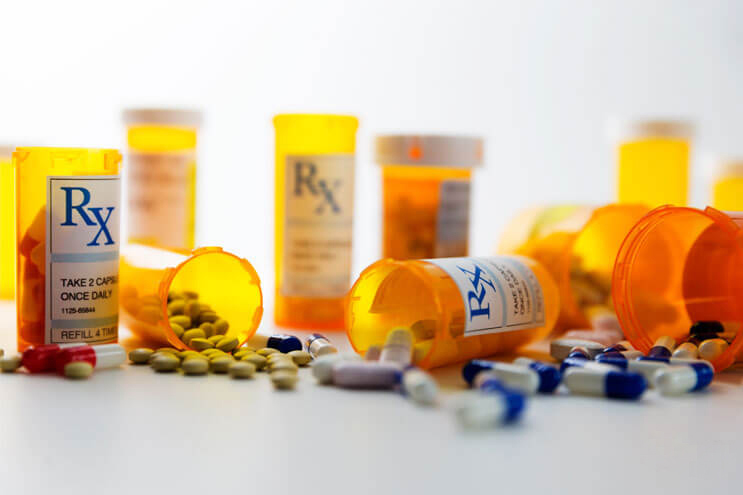 An array of prescription bottles. Discover the effects of long term opioid use.
