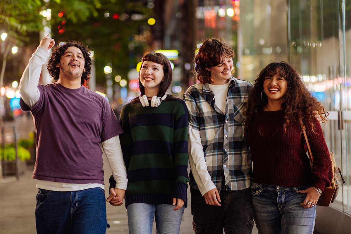 A group of teens out at night holding hands and walking down a city street. Find out how teen substance use increases the risk of misuse.